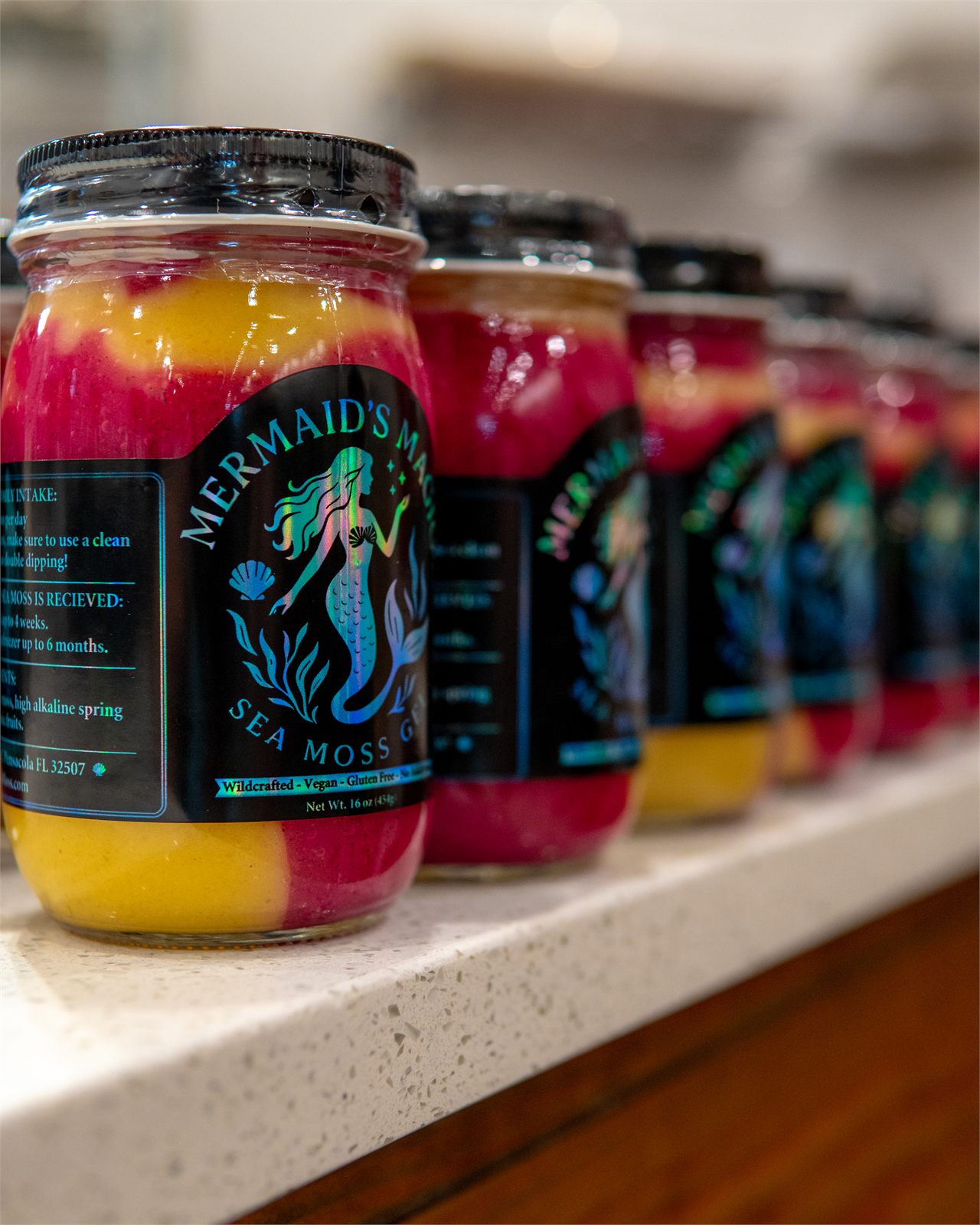 A row of Mermaids Magic sea moss gel jars on a store shelf