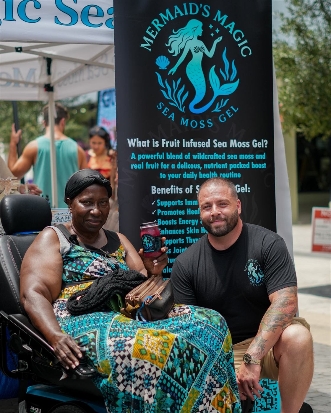 Alan with a customer at the Mermaids Magic booth